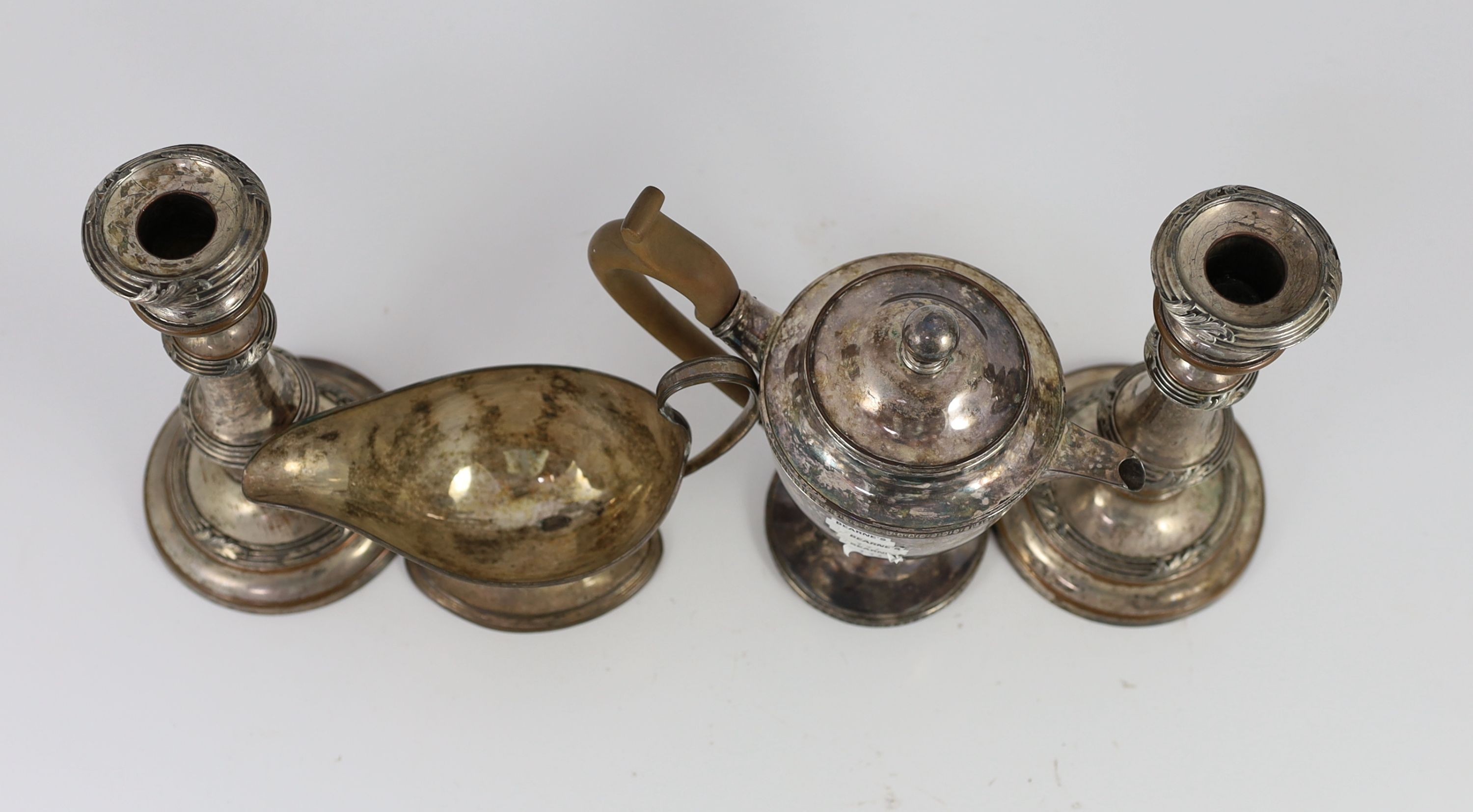 A pair of Sheffield plate candlesticks and nozzles, 18cm high
